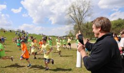 PHM parents, teachers, staff, and coaches cheer students on during the races
