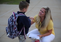 Mrs. McCambridge greets Northpoint kindergartners on the 1st Day of Kindergarten